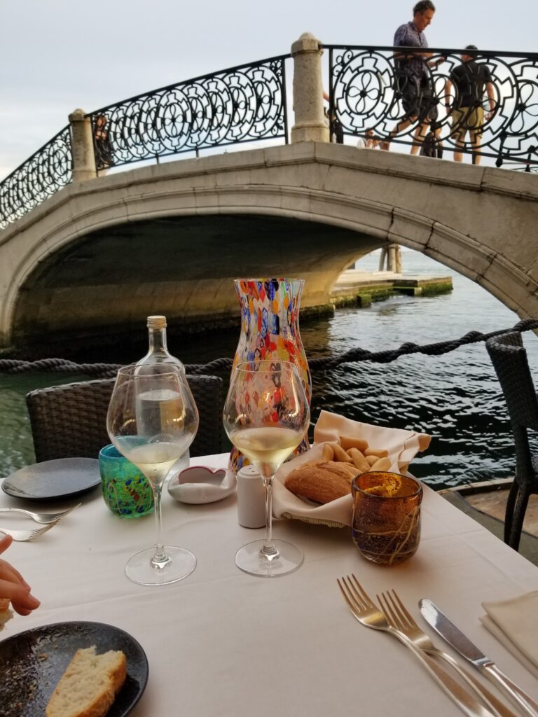 A view of the wine served at Ristorante Carpaccio and the waterway right on the edge of their patio.